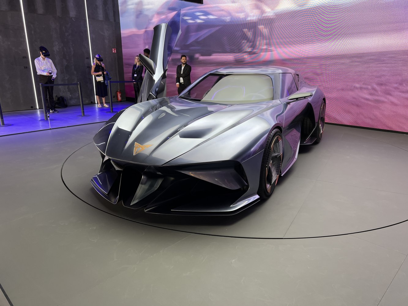 Futuristic coupe with gullwing doors and aerodynamic sharp design.