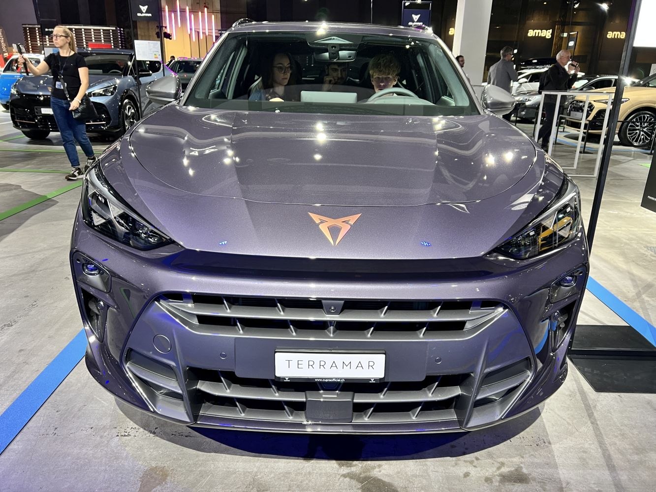 Close-up of SUV front fascia and grille with angular headlights.