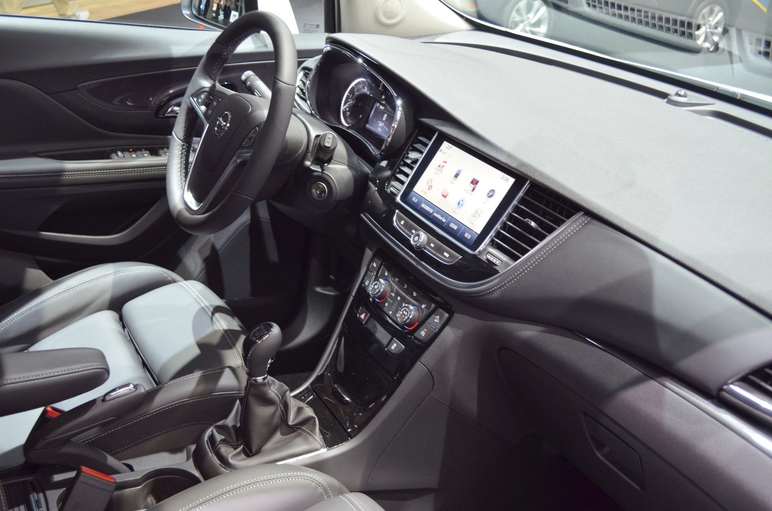 Interior dashboard with manual gear shift and infotainment system