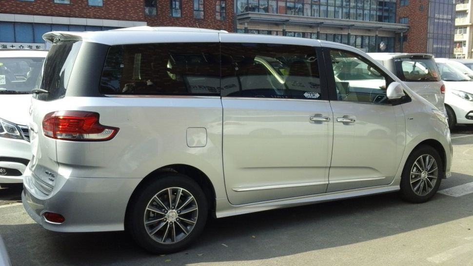 Silver minivan side profile with sliding doors and alloy wheels