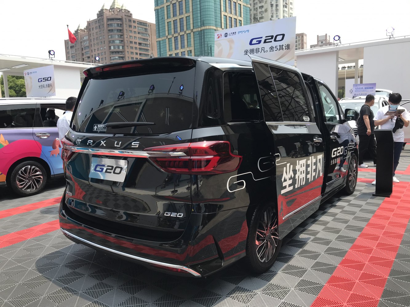 MPV rear view with sliding door and modern tail light design
