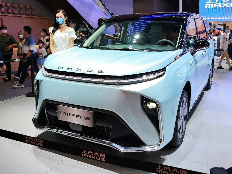 Front view of electric minivan with sleek headlights and modern design