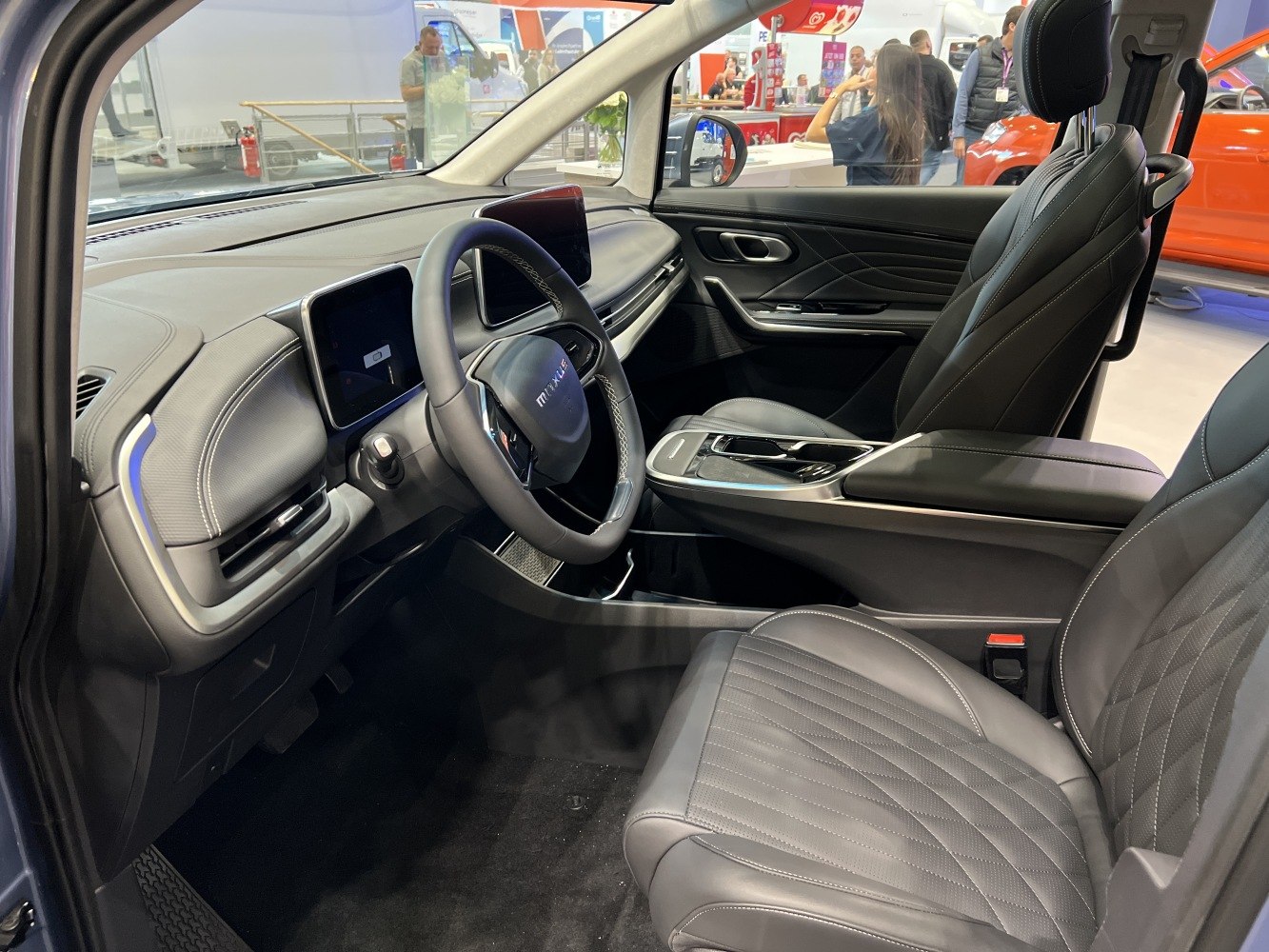 Dual digital dashboard displays and premium leather seats interior