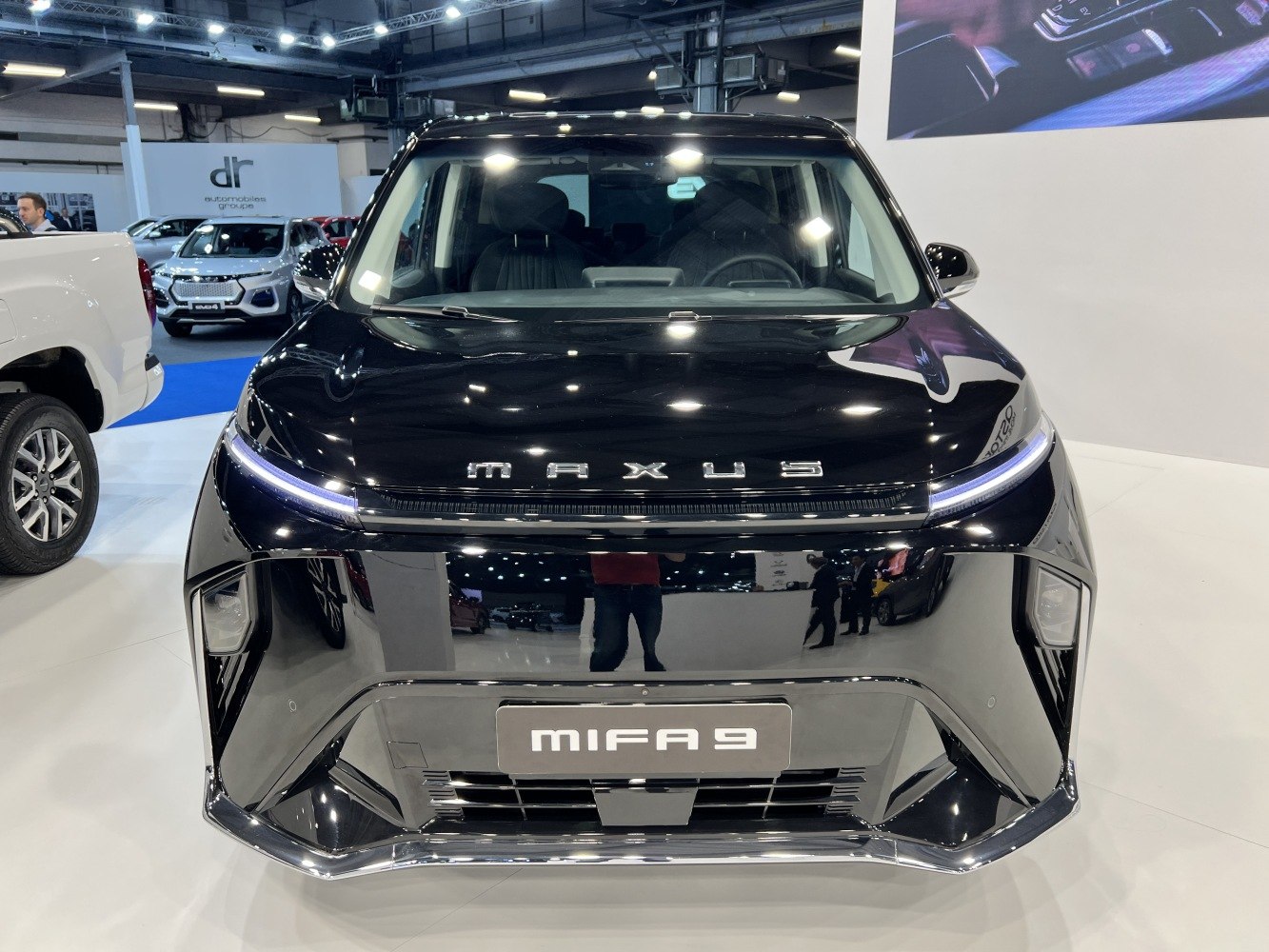 Sleek front fascia with LED strip and distinctive front grille.