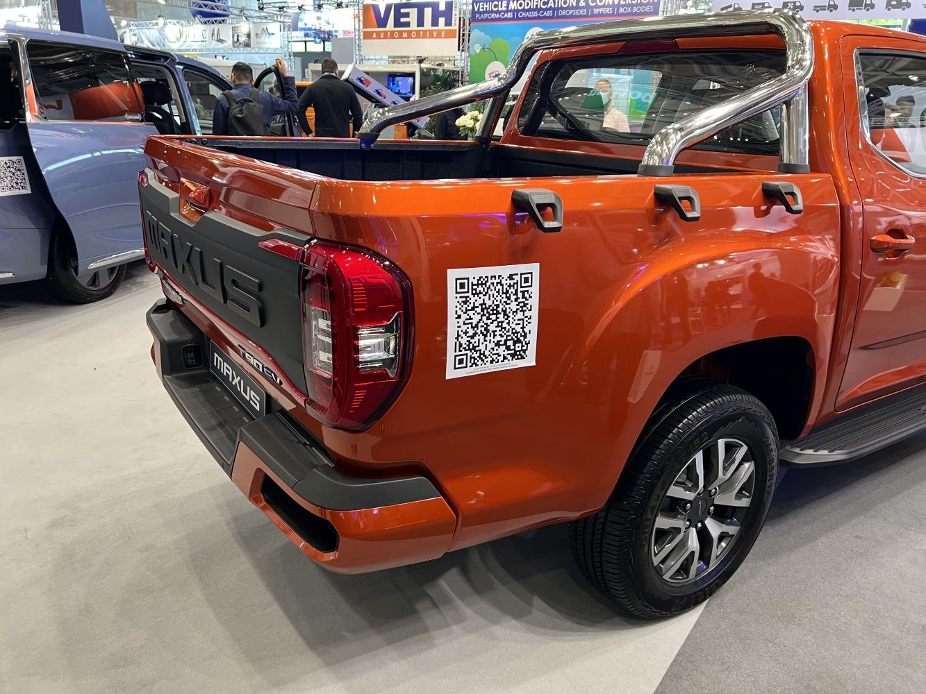 Pickup bed and rear design with chrome roll bar and hooks