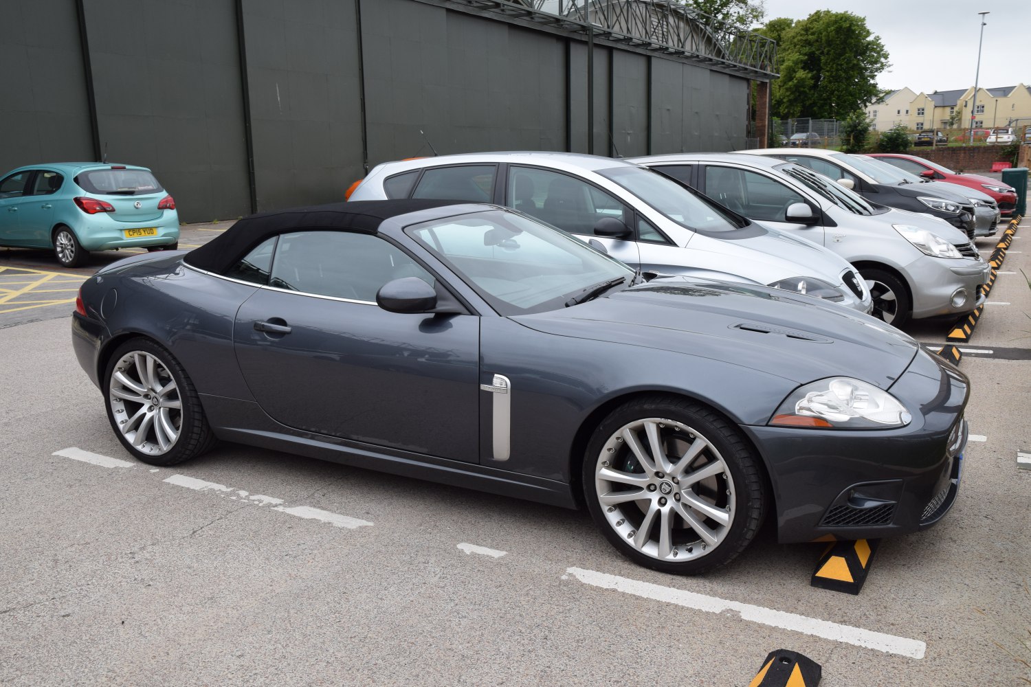 Soft top convertible sports coupe with sleek side profile and alloy wheels