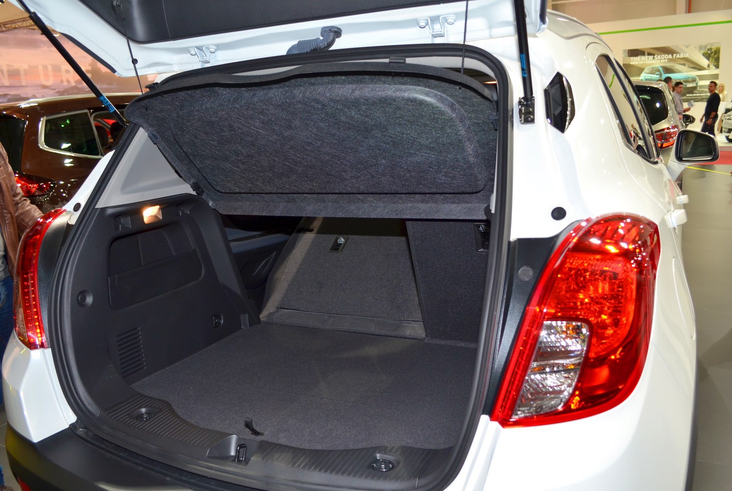 Open rear hatch showing spacious trunk with folded rear seats