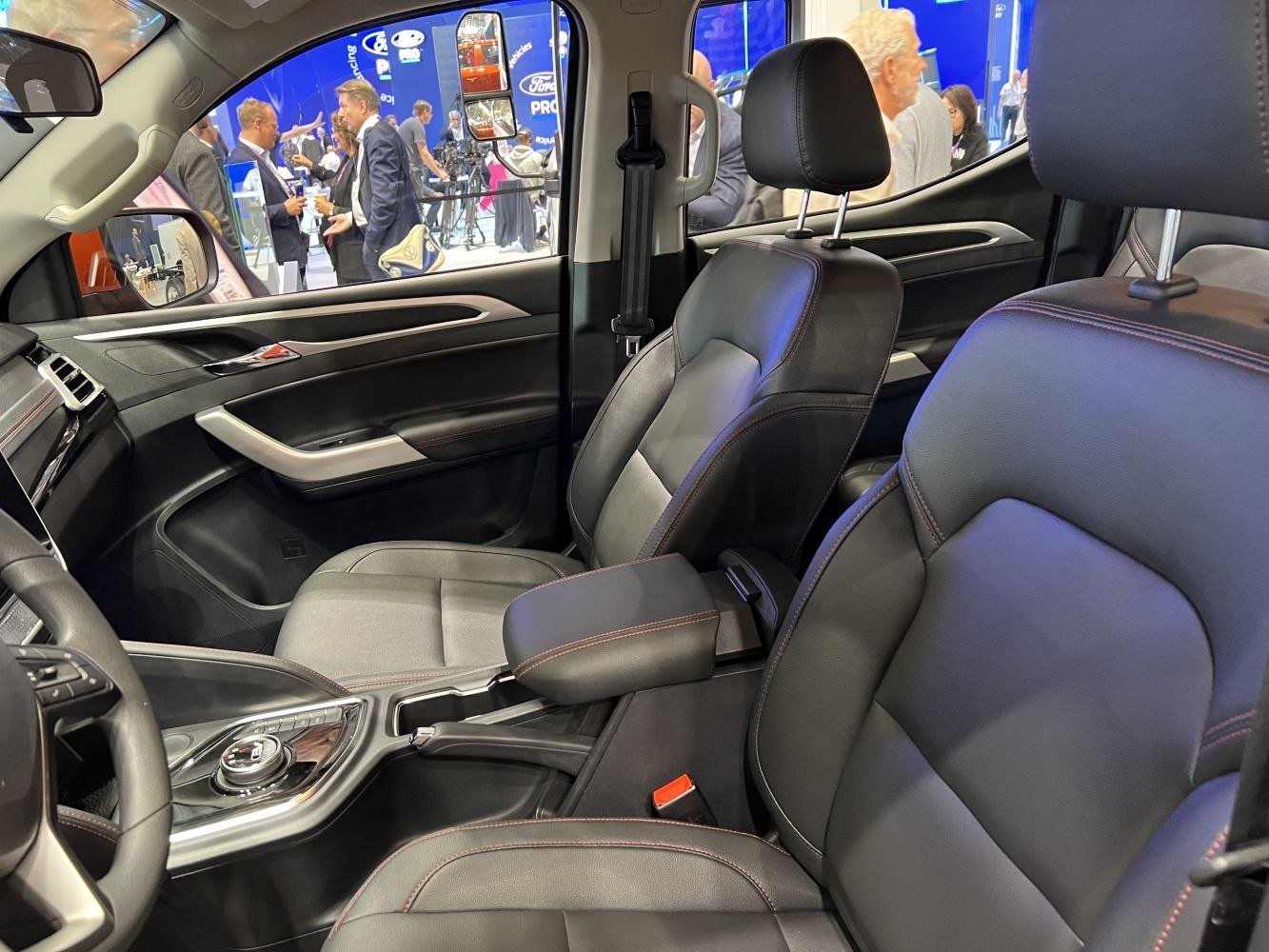 Leather seats with modern center console and door panel details