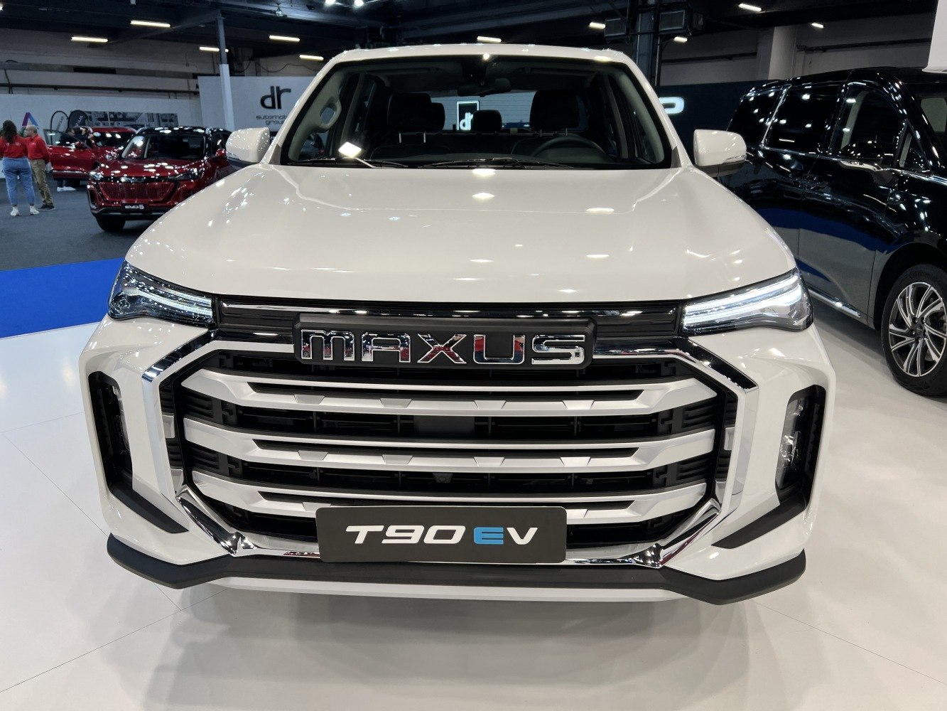 Front grille and slim LED headlights of an electric pickup truck