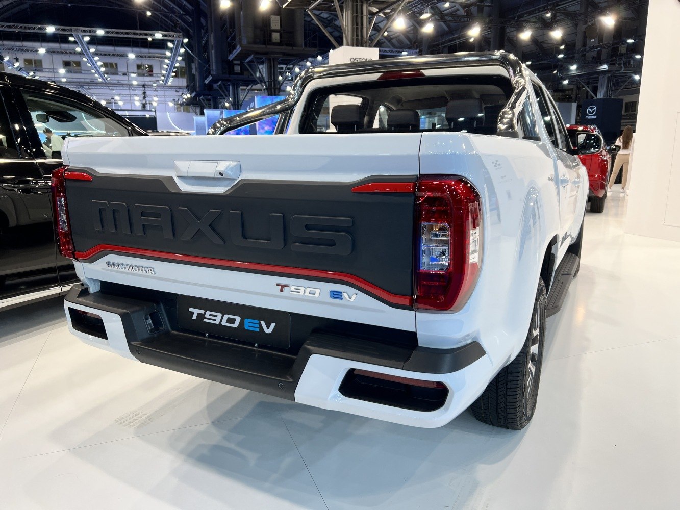 Rear view of electric pickup truck with distinctive tailgate and LED taillights