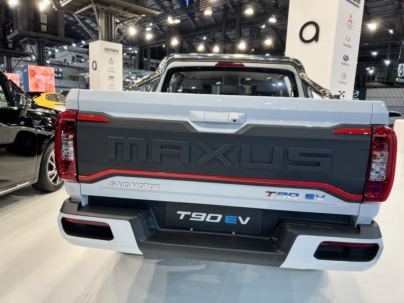 Electric pickup rear view with distinct tailgate and lights.