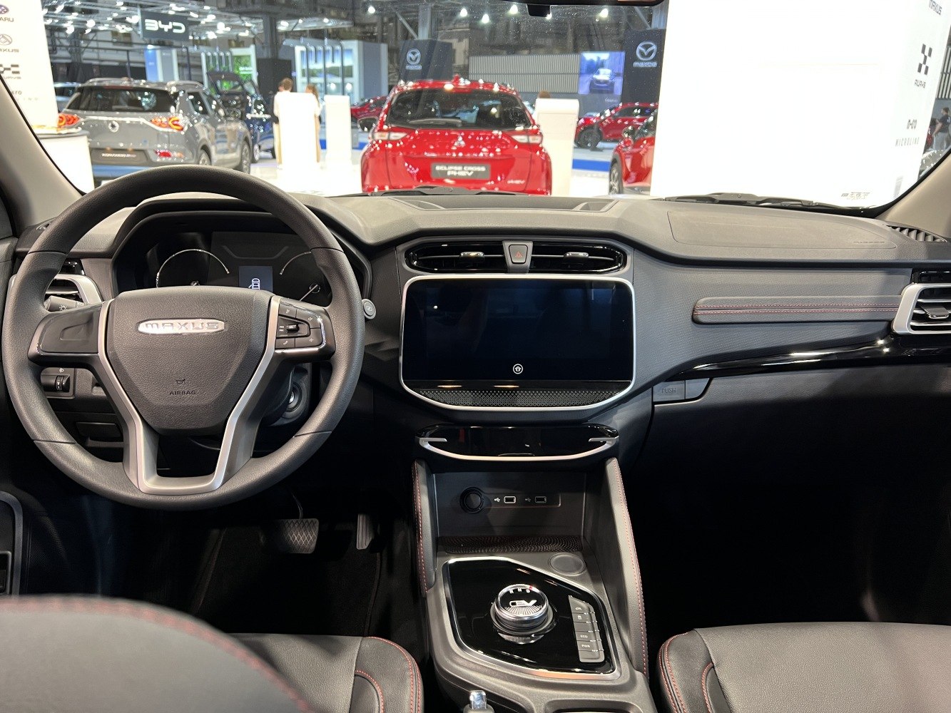 Dashboard, steering wheel, and central touchscreen display