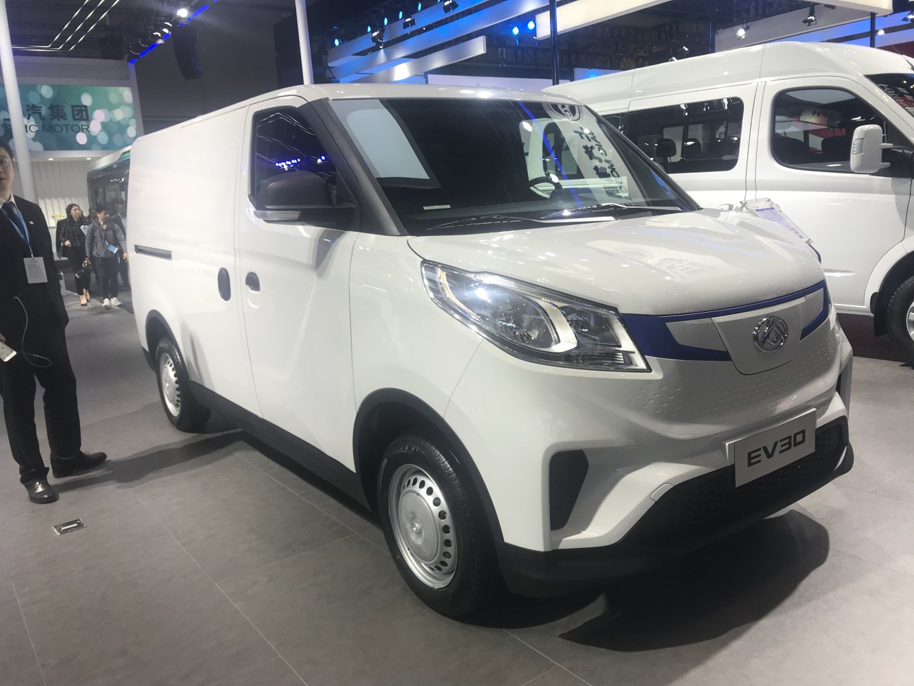 Front three-quarter view of electric commercial van with modern headlights