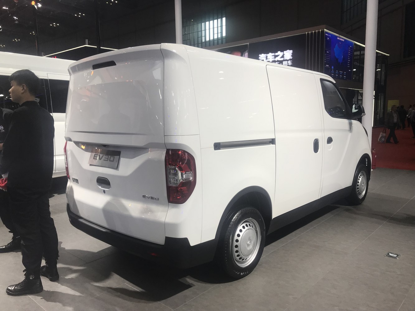 Electric compact cargo van rear and side view with sliding door