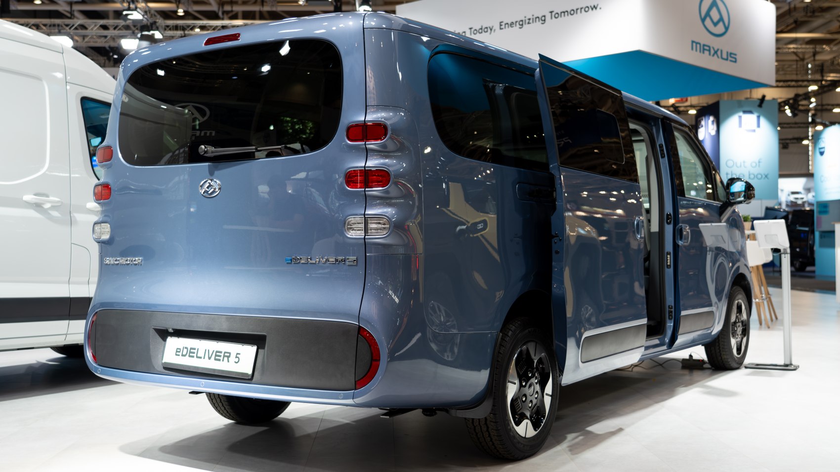 Rear view of electric delivery van with vertical rear lights and sliding side door