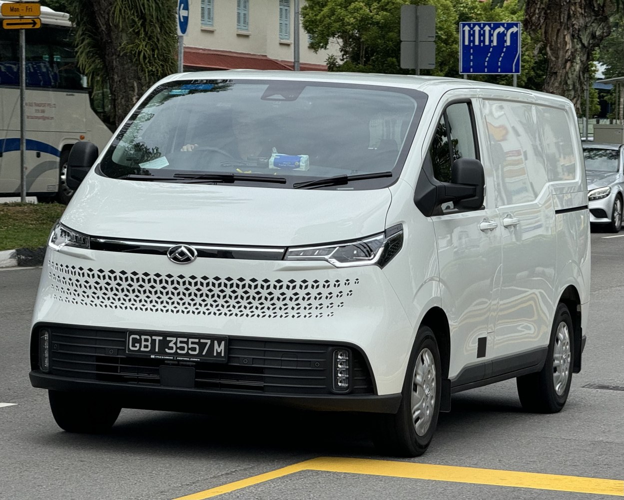 Modern electric van front view with honeycomb grille design
