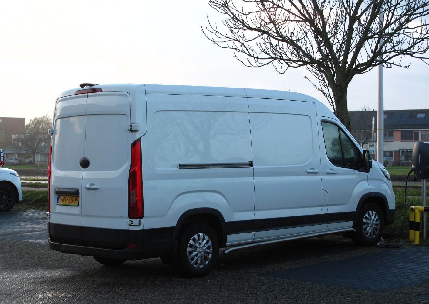 Large electric cargo van with high roof and rear barn doors