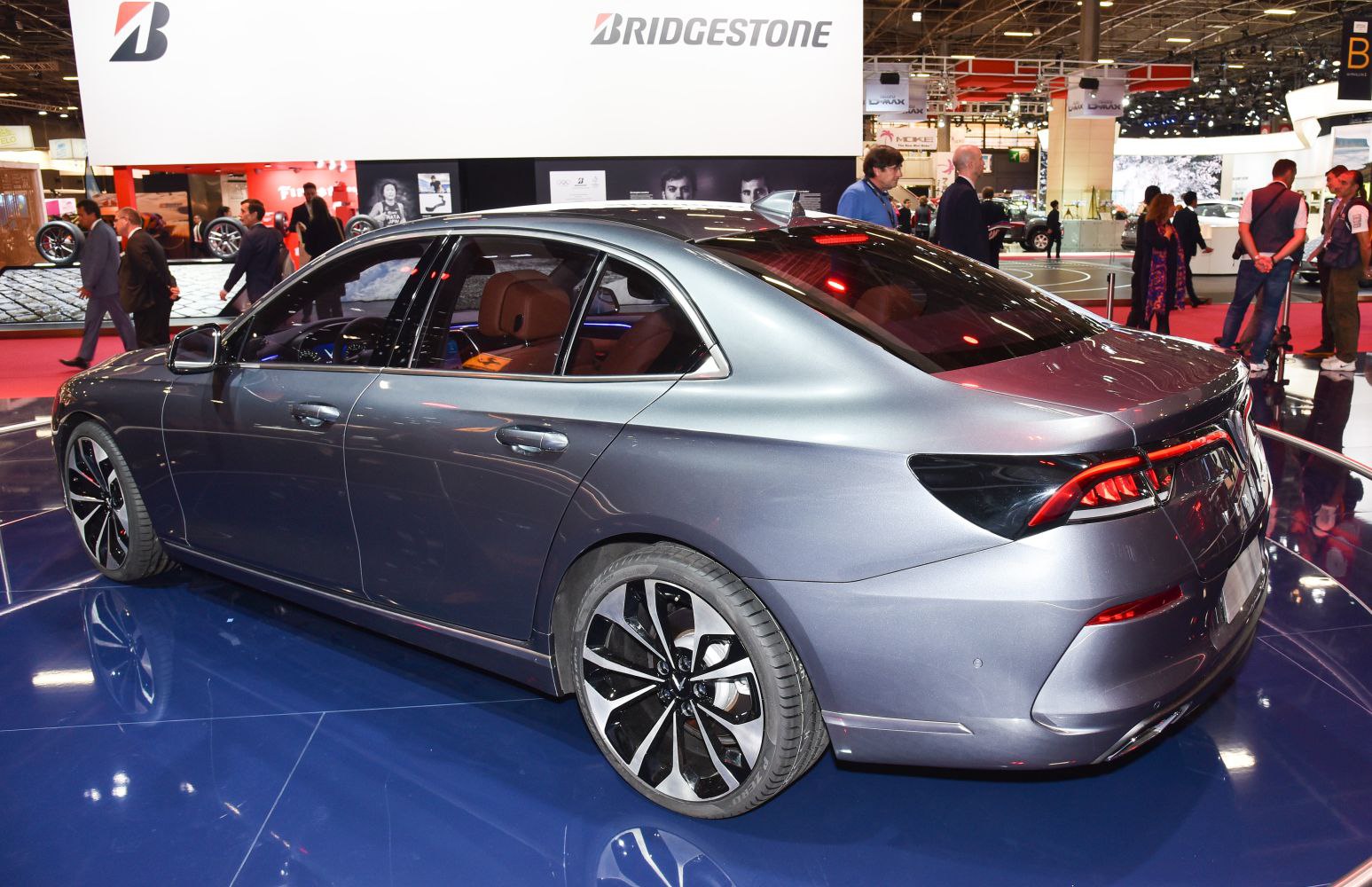 Rear side view of sedan with modern taillights and alloy wheels