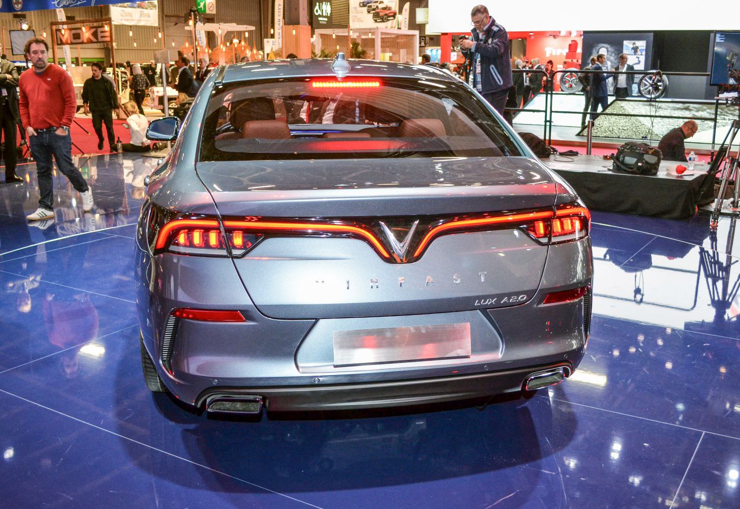Rear view of a sedan with LED tail lights and dual exhausts