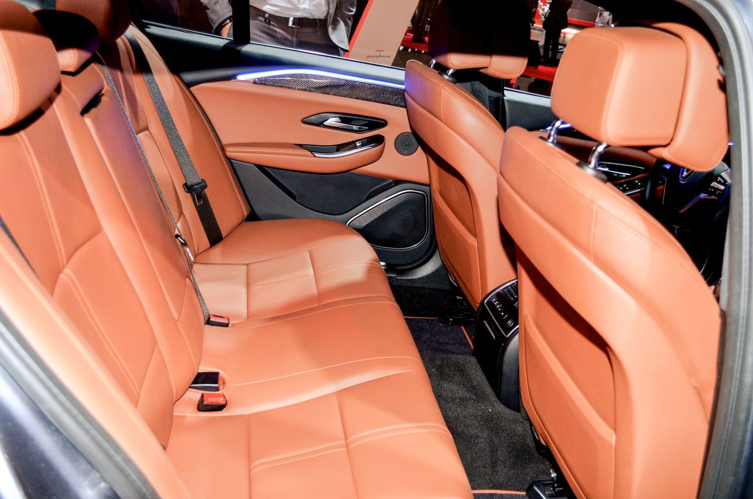 Rear tan leather seats with refined modern interior details