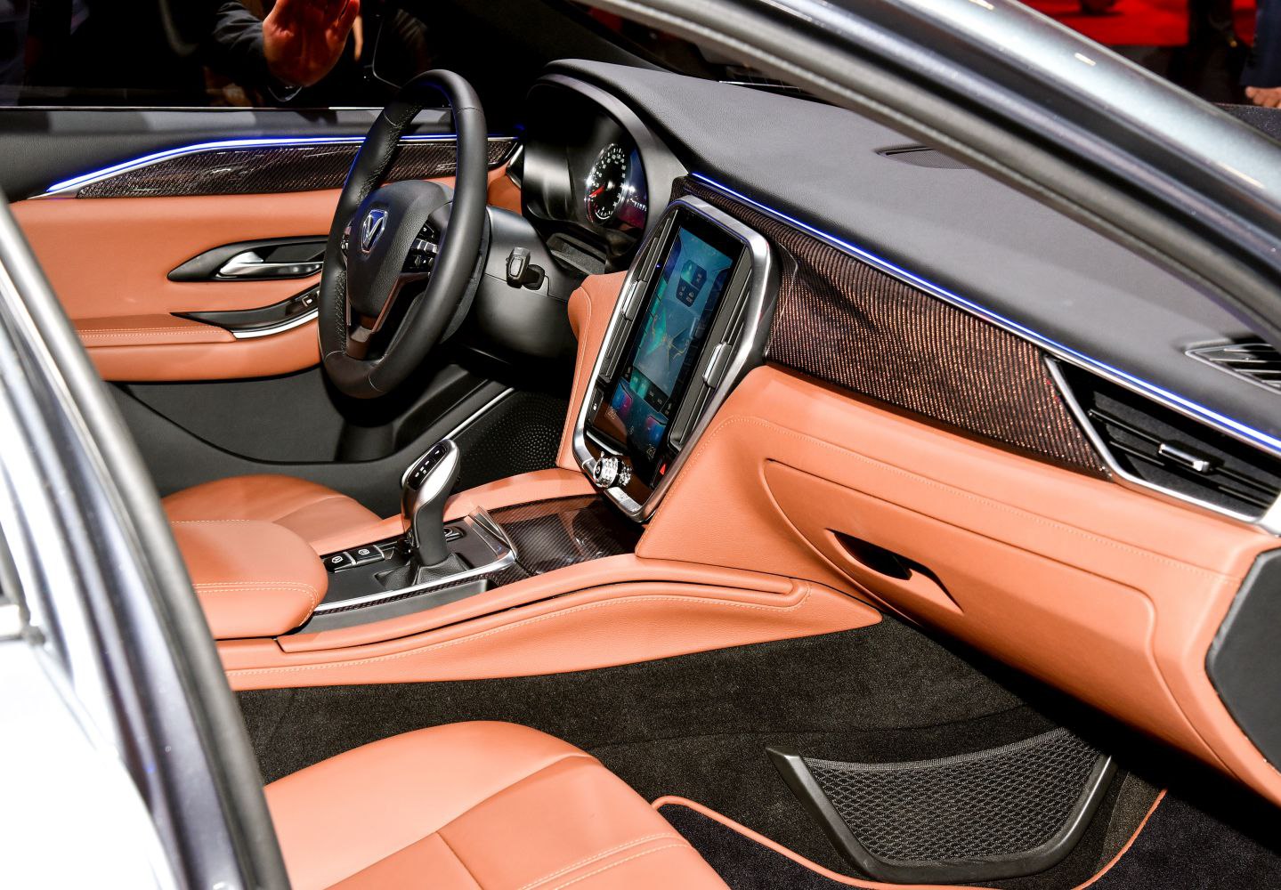 Leather seats and touchscreen infotainment system in premium car interior