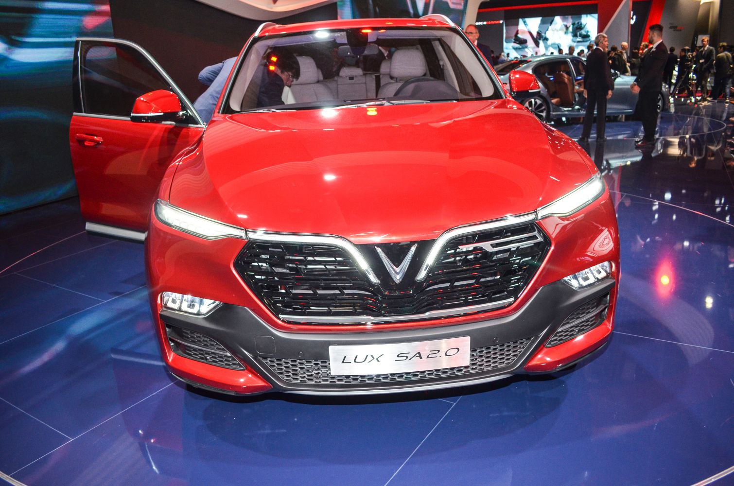 Front view with distinctive LED headlights and bold grille
