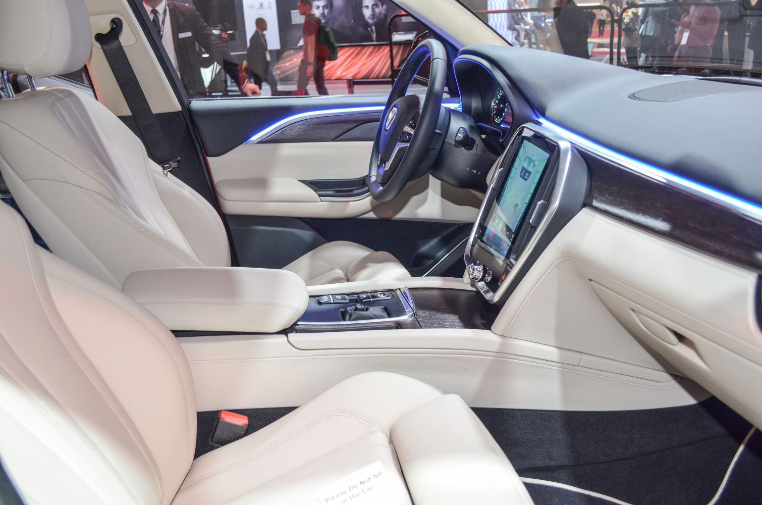Beige leather seats, digital touchscreen, ambient lighting interior