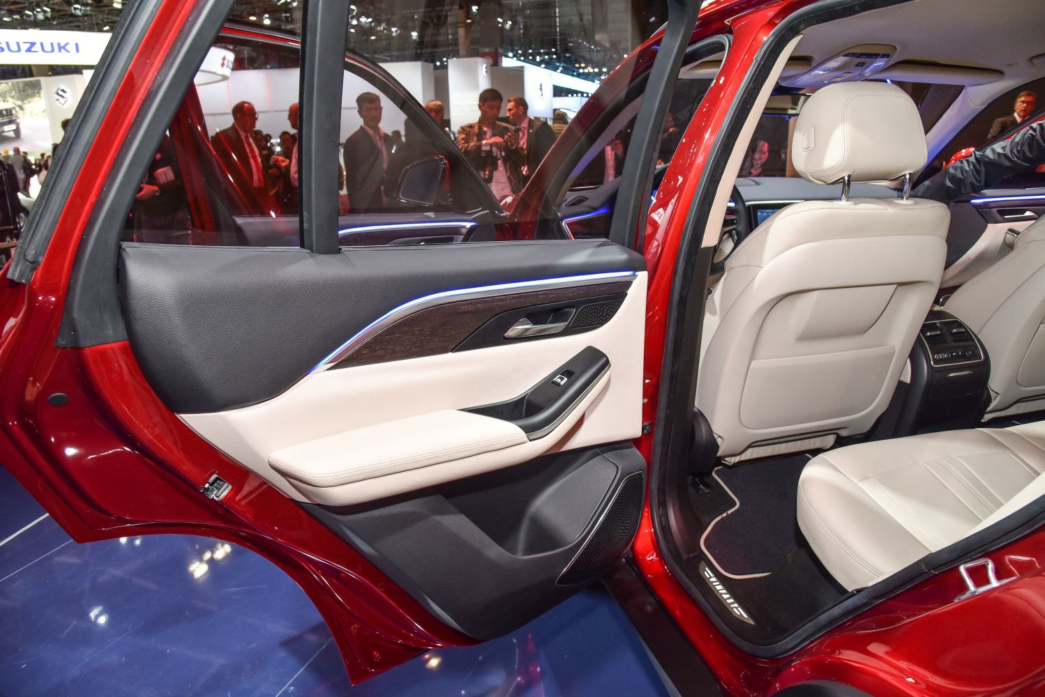 Rear passenger door interior with beige leather and trim detailing