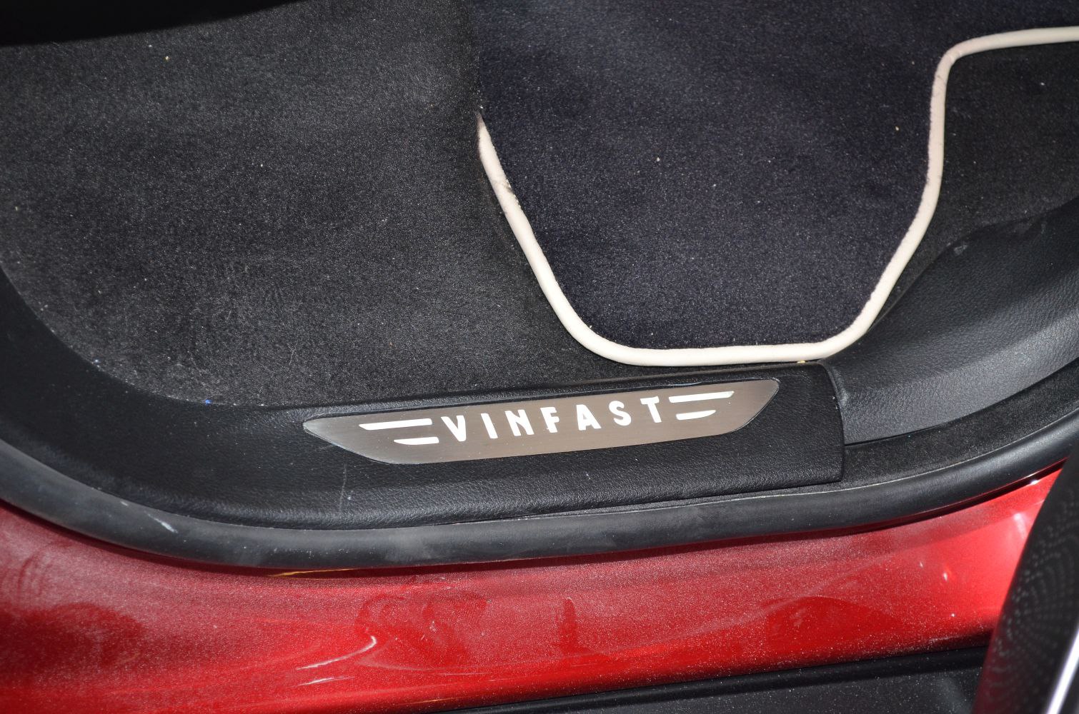Close-up of VinFast LUX SA door sill plate and interior floor mat edge