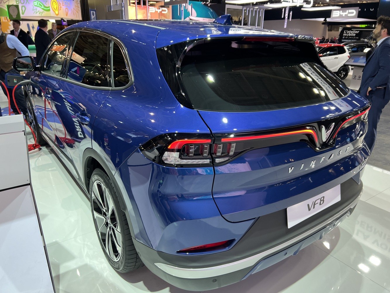 Blue electric SUV rear with LED tail lights and sleek modern design