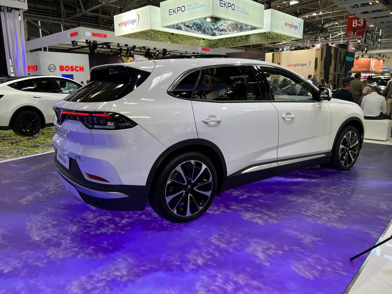 White SUV rear side profile with modern taillights and alloy wheels