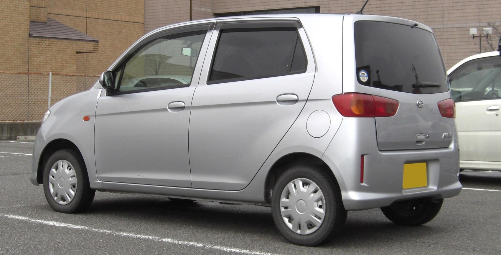 Compact hatchback with tinted rear windows and simple taillights