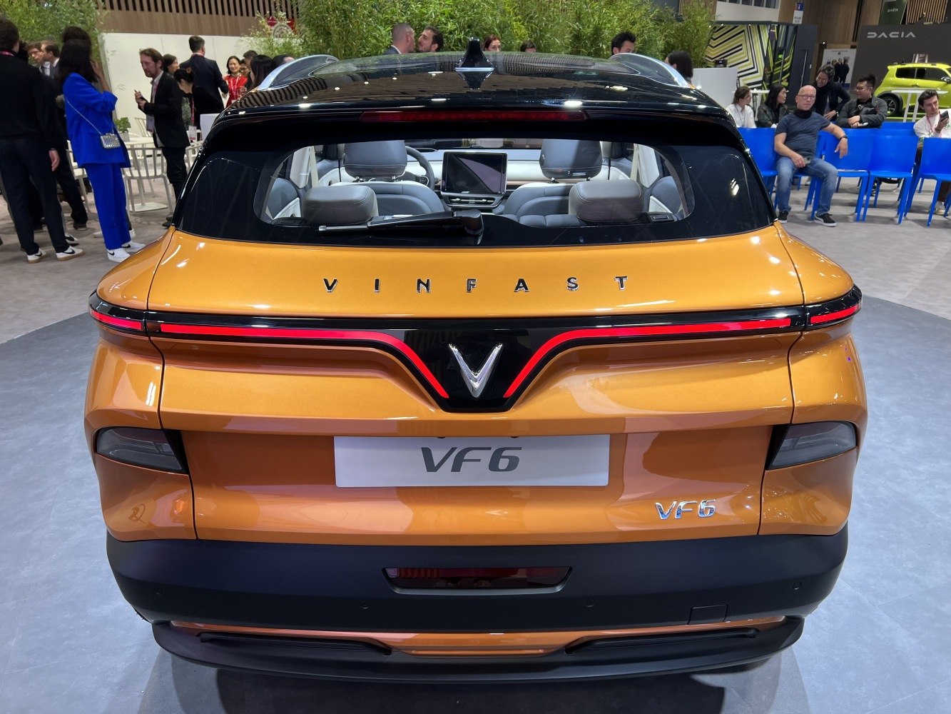 Rear view of hatchback with continuous LED taillight strip and black roof