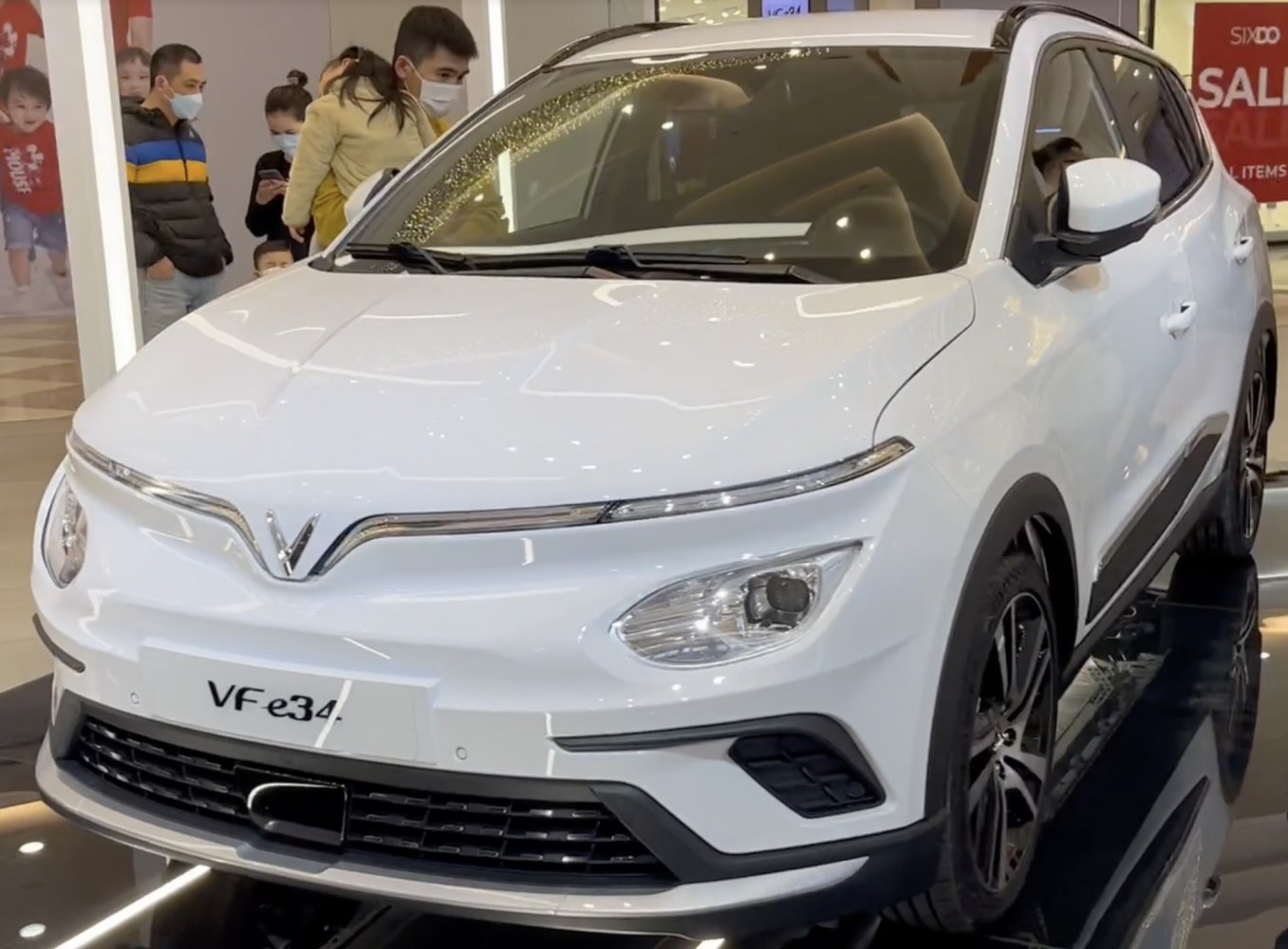 Front view of electric SUV with sleek headlights and aerodynamic design