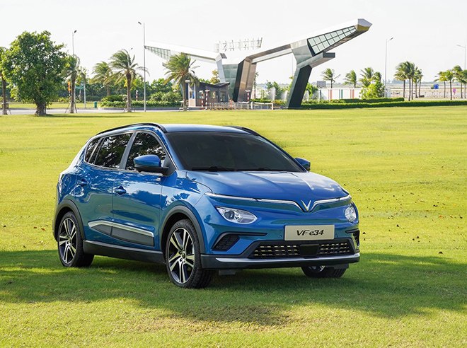 Blue electric SUV front three-quarter exterior view with alloy wheels