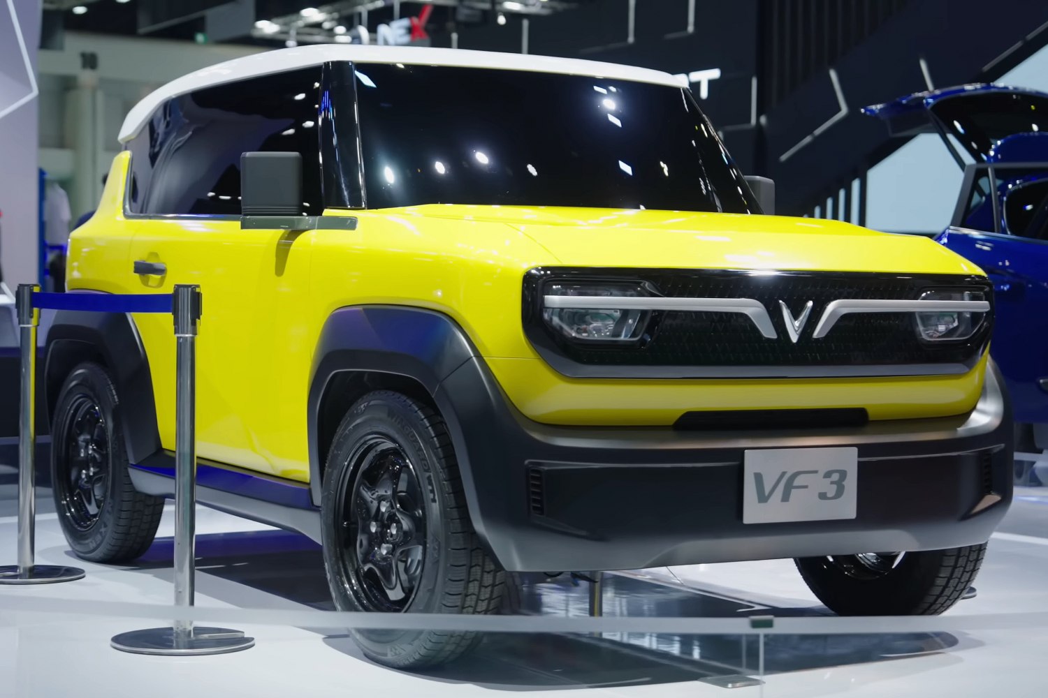 Front view of yellow compact electric SUV with black grille and modern headlights