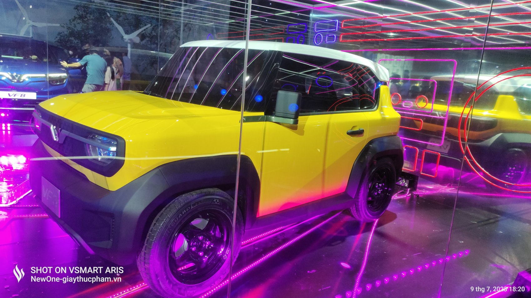 Compact electric SUV yellow with white roof and rugged black accents
