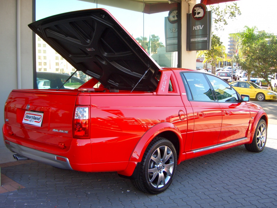 Pickup truck with open tonneau cover and sporty wheels