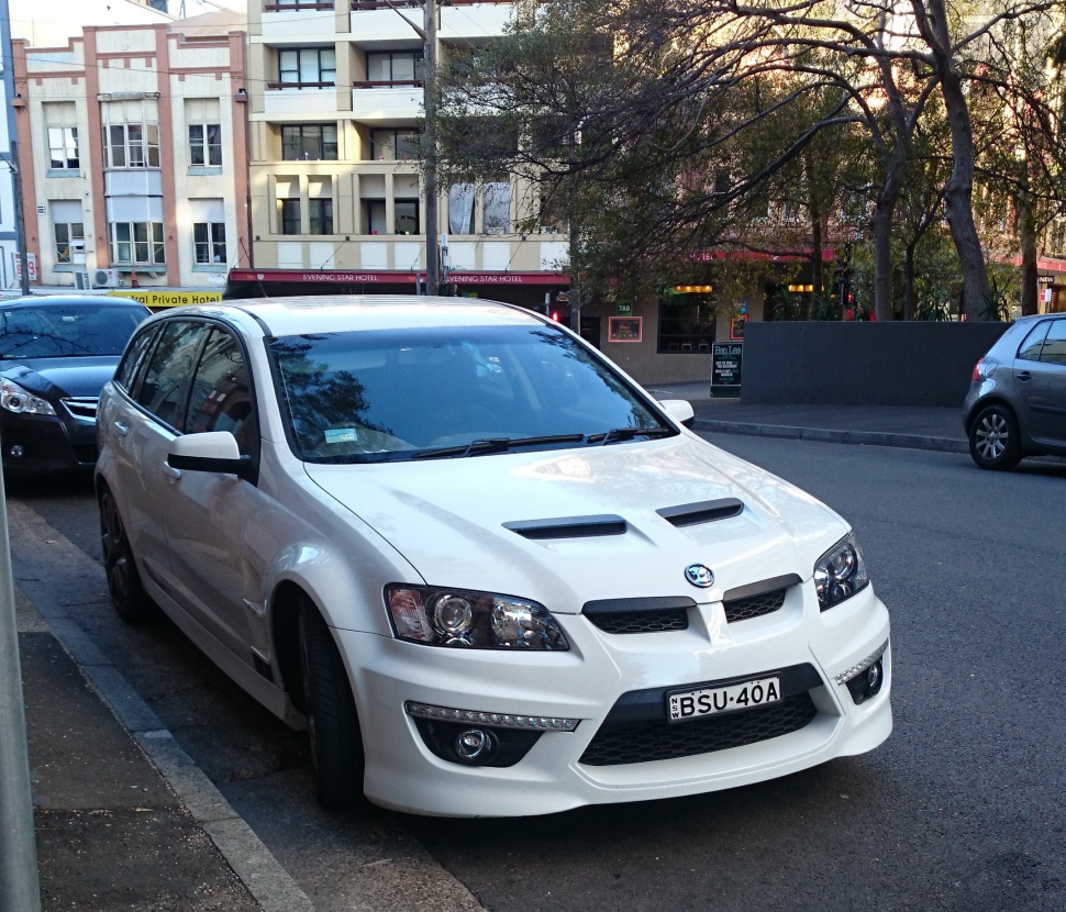 Front view of a sports wagon with hood vents and aggressive bumper design