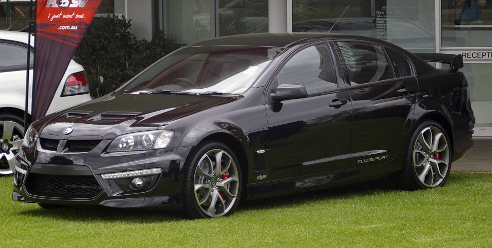 Aggressive front fascia and sporty alloy wheels with side Clubsport branding on black sedan