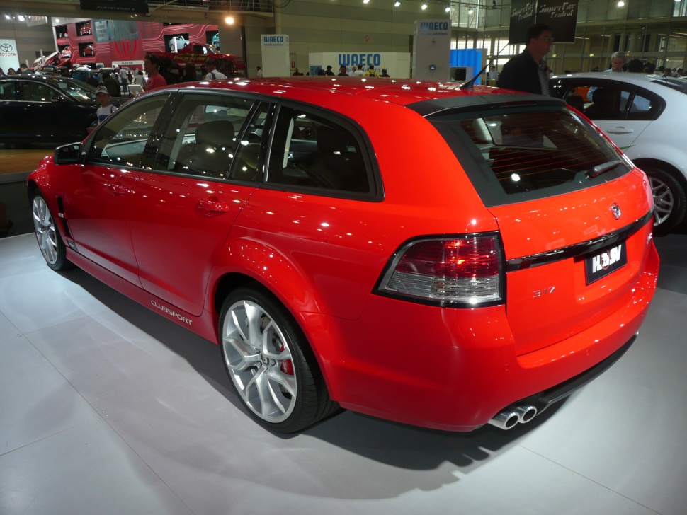 Red red station wagon rear view with dual exhaust and distinct taillights