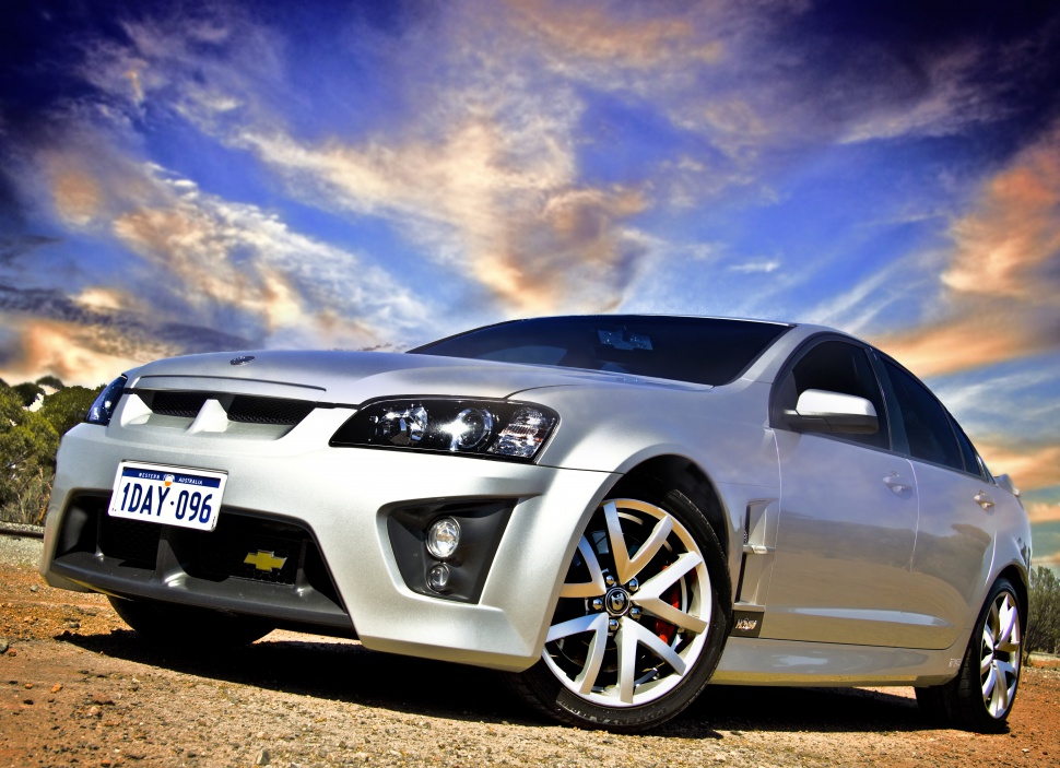 Silver high-performance sedan front view with alloy wheels