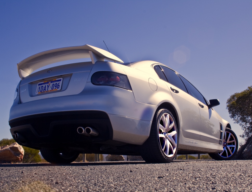 Rear angle with large spoiler and dual exhaust pipes