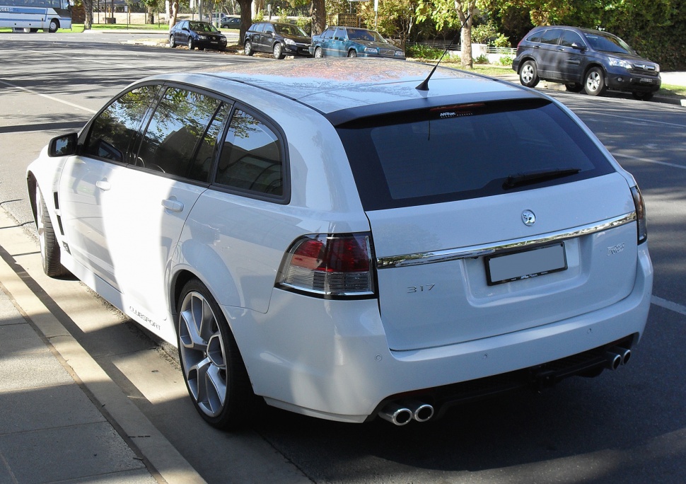 Rear view of white wagon with quad exhaust