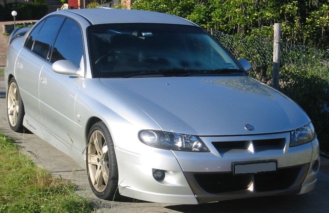 Silver sporty sedan front and alloy wheels