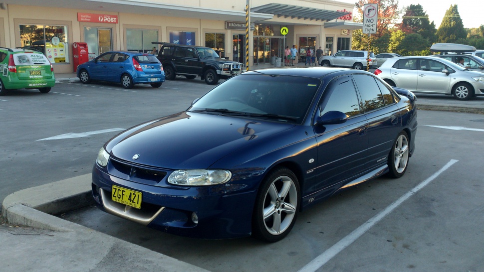 Sporty front-side view with alloy wheels and tinted windows