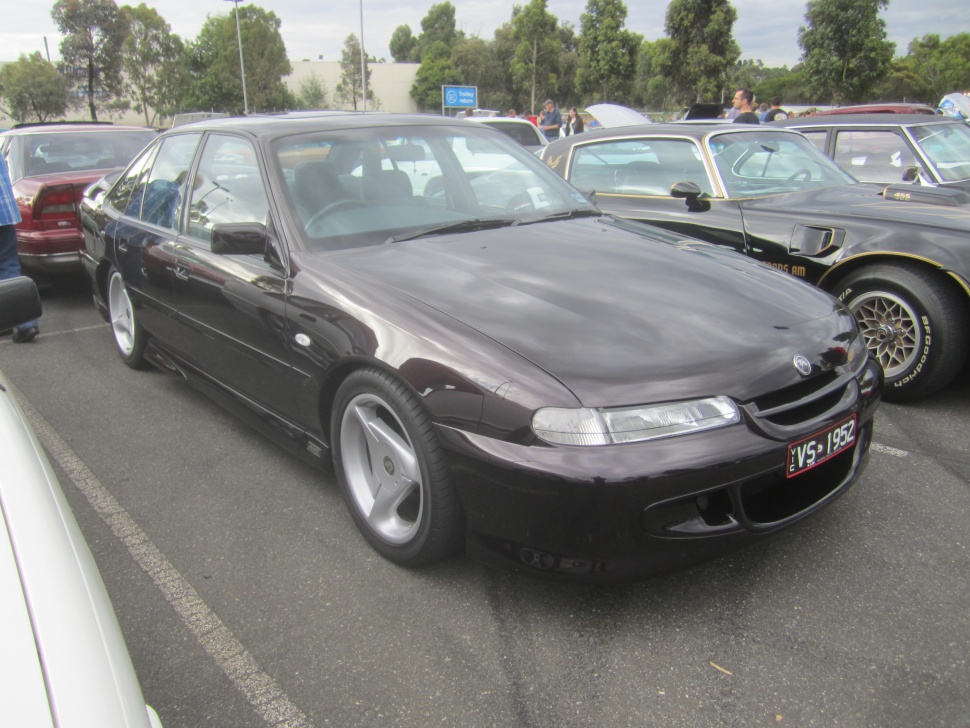 Front view and alloy wheels of classic performance sedan