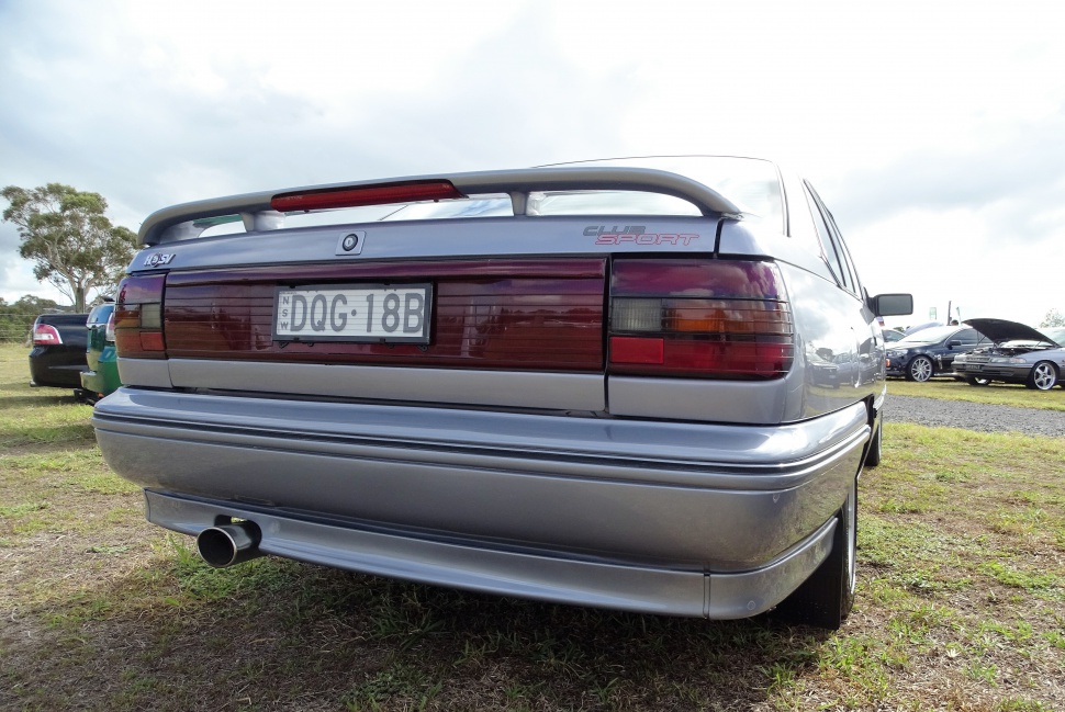 Rear rear spoiler, taillights, and exhaust tip from classic sedan