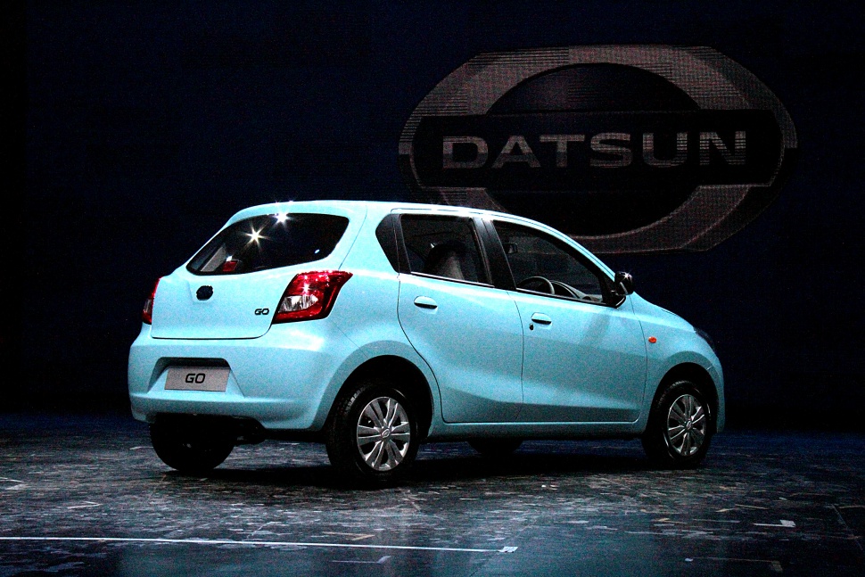 Rear and side profile of a compact hatchback with simple wheel covers