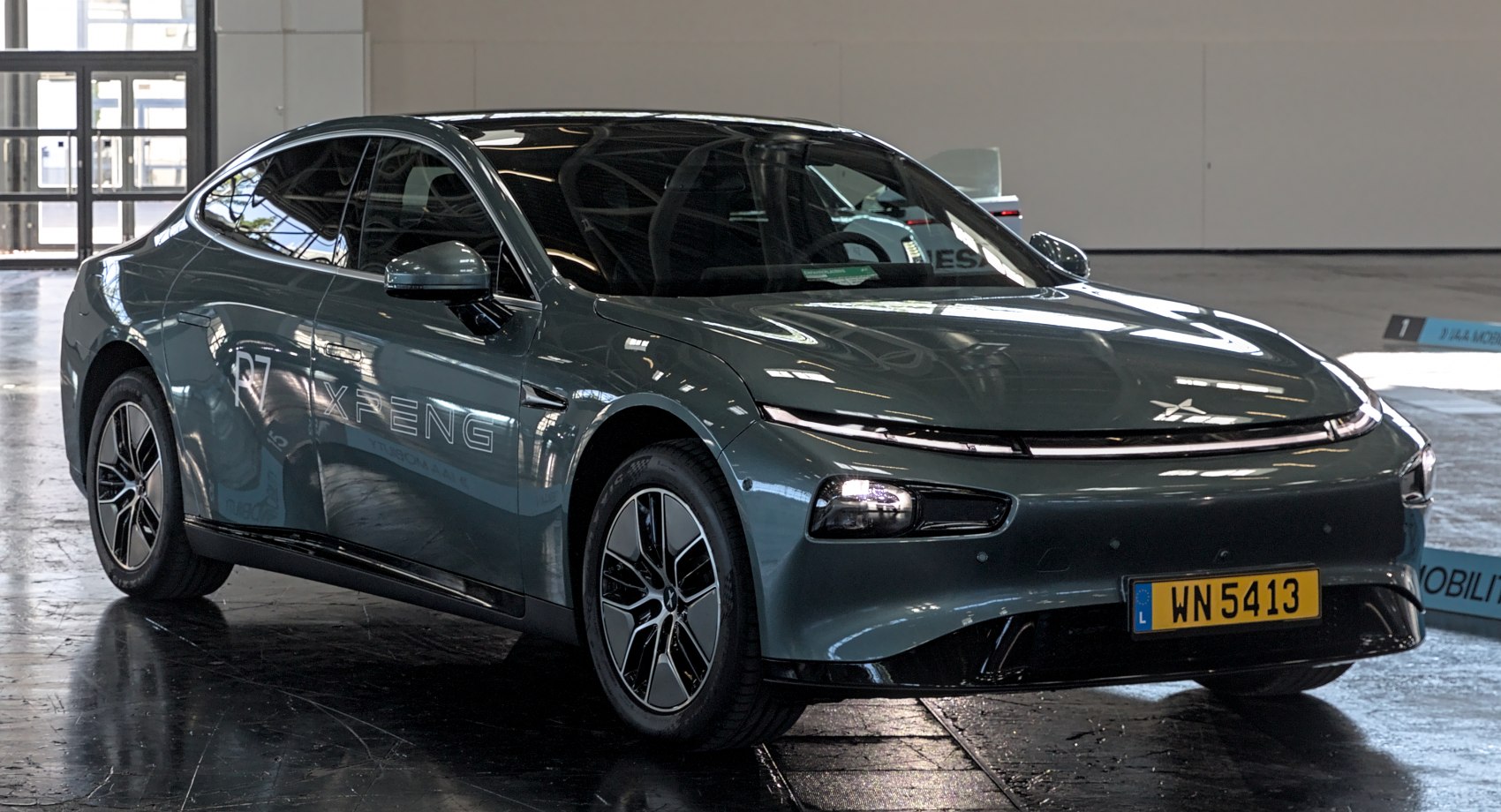 Aerodynamic front design with sharp LED headlights and glossy finish